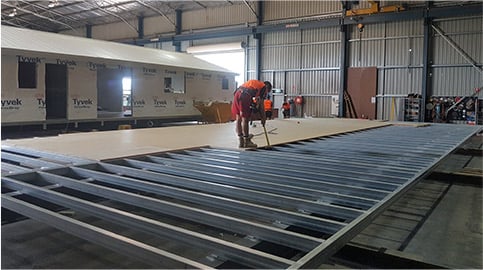 The base of a modular home being built within a factory